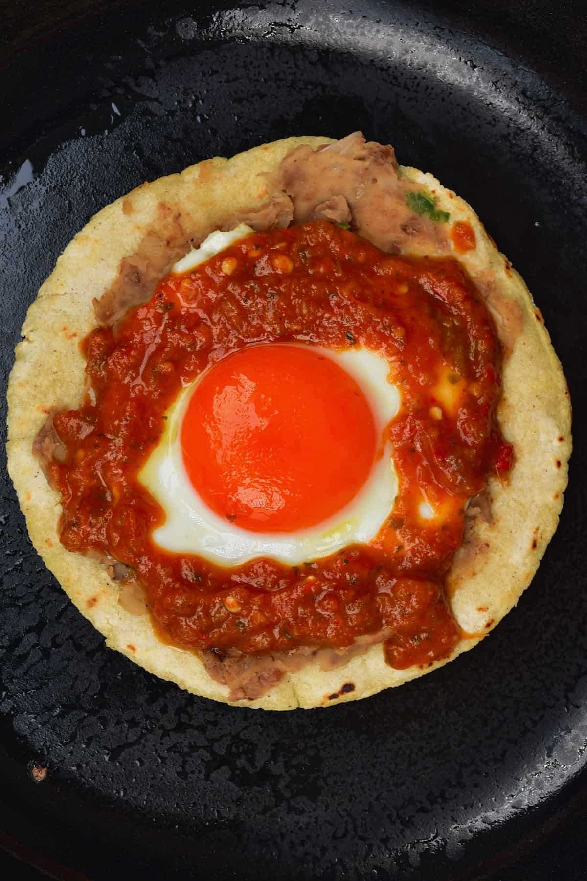 Making huevos rancheros in a pan