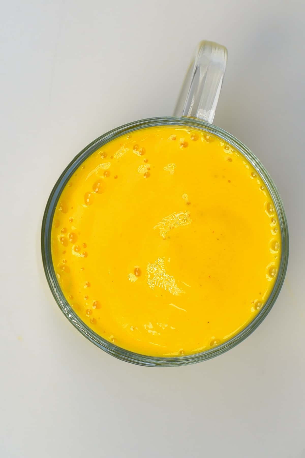 A cup with mango lassi