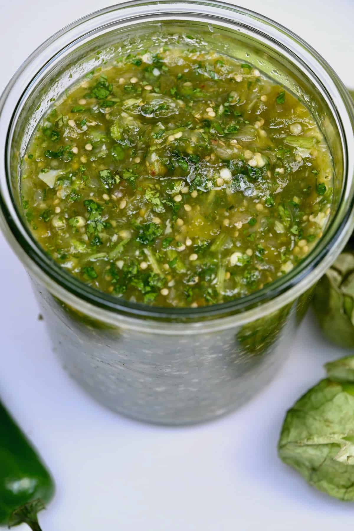 Salsa verde (tomatillo green chili salsa) in a jar