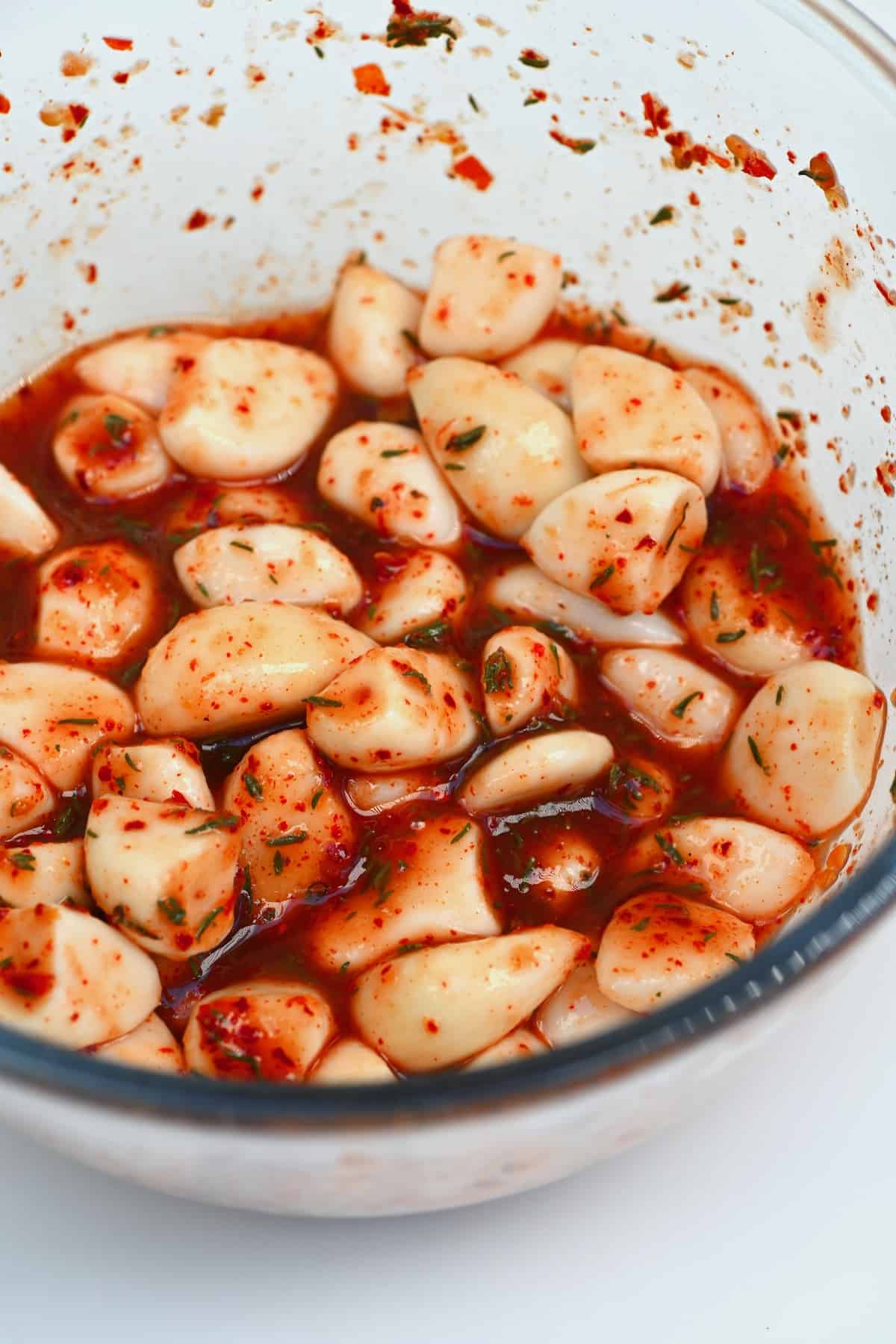 A bowl with spicy pickled garlic