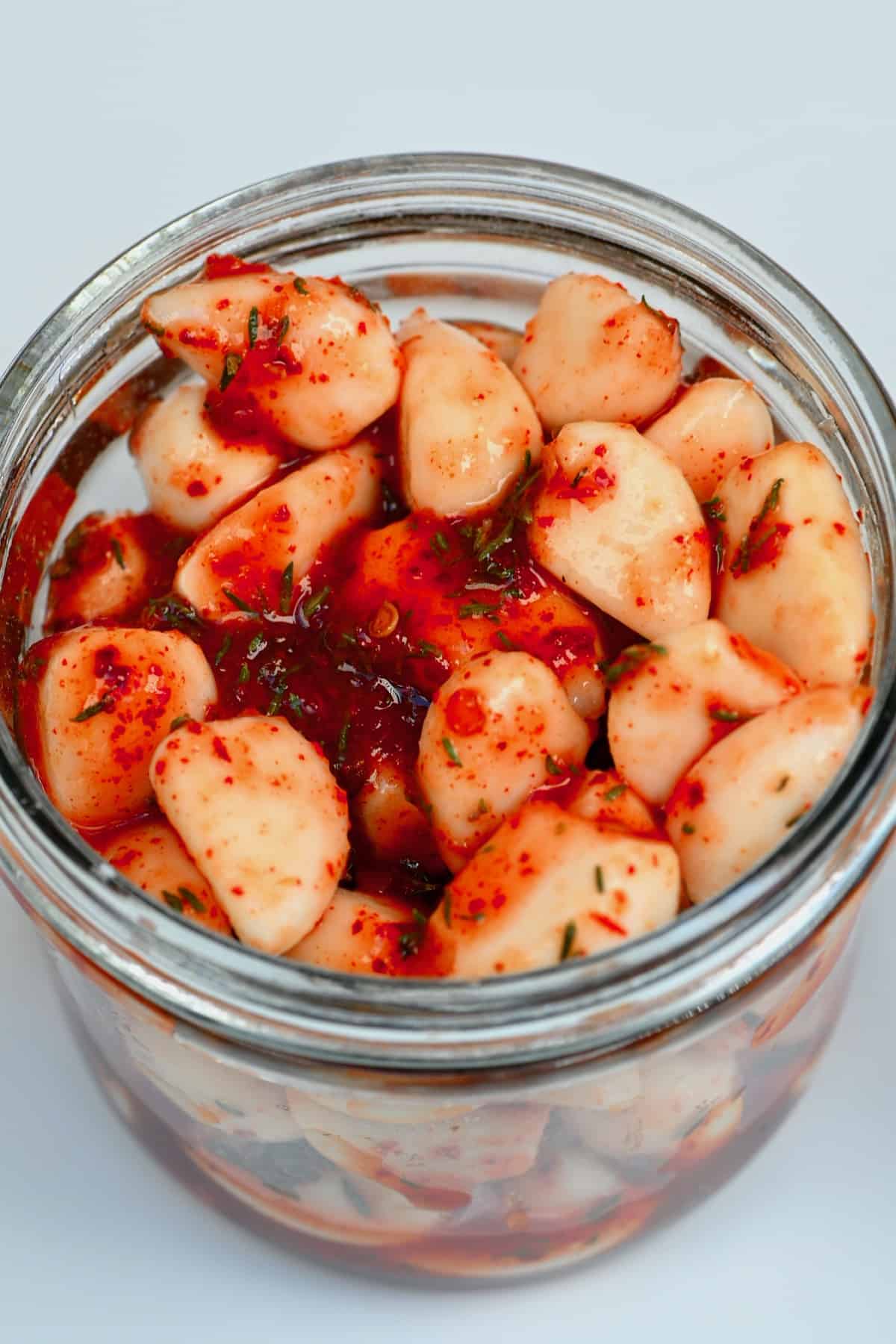 A jar with spicy pickled garlic