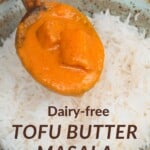 Pouring Tofu butter chicken over rice