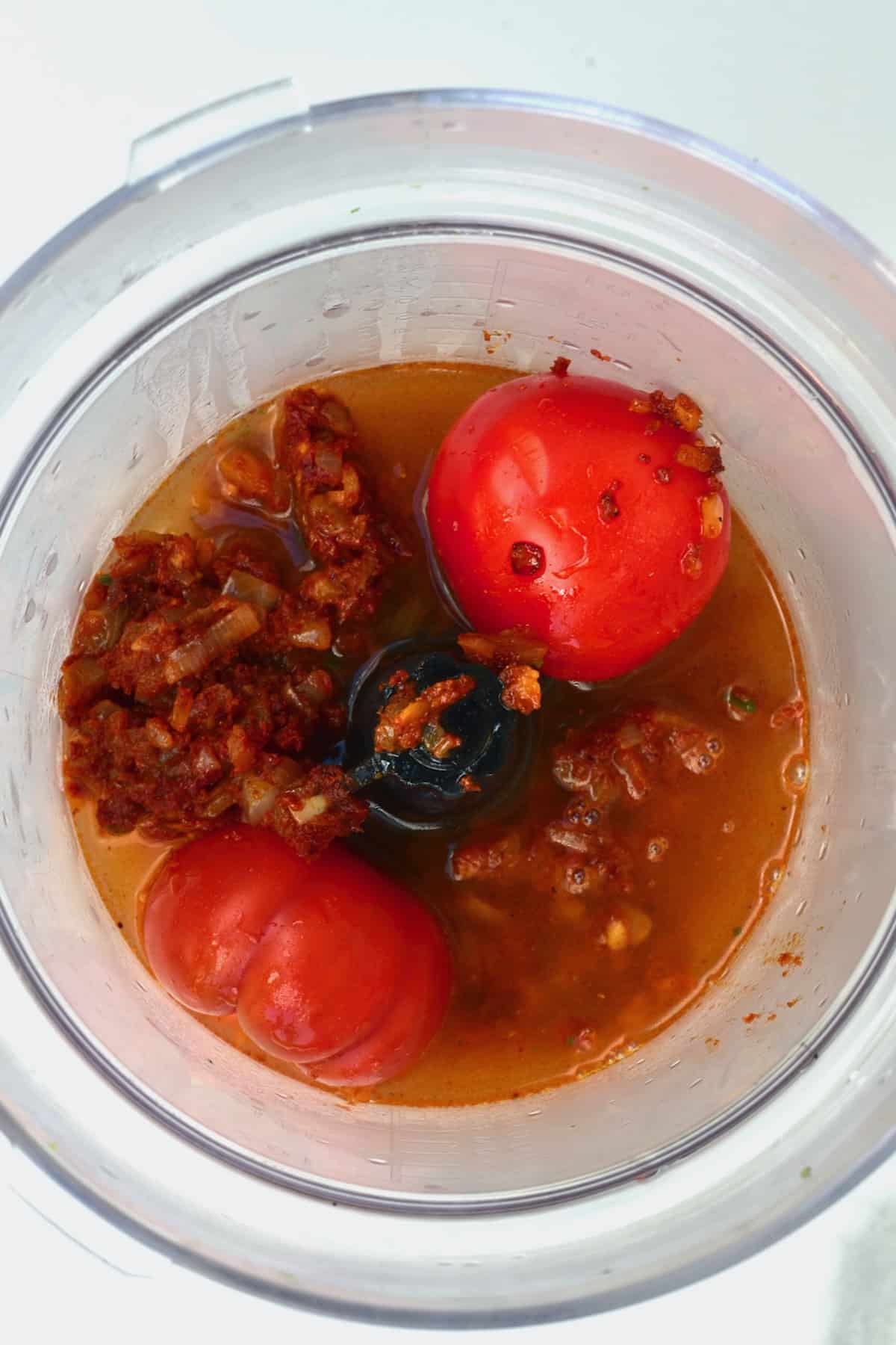 Tomatoes and sauce in a blender