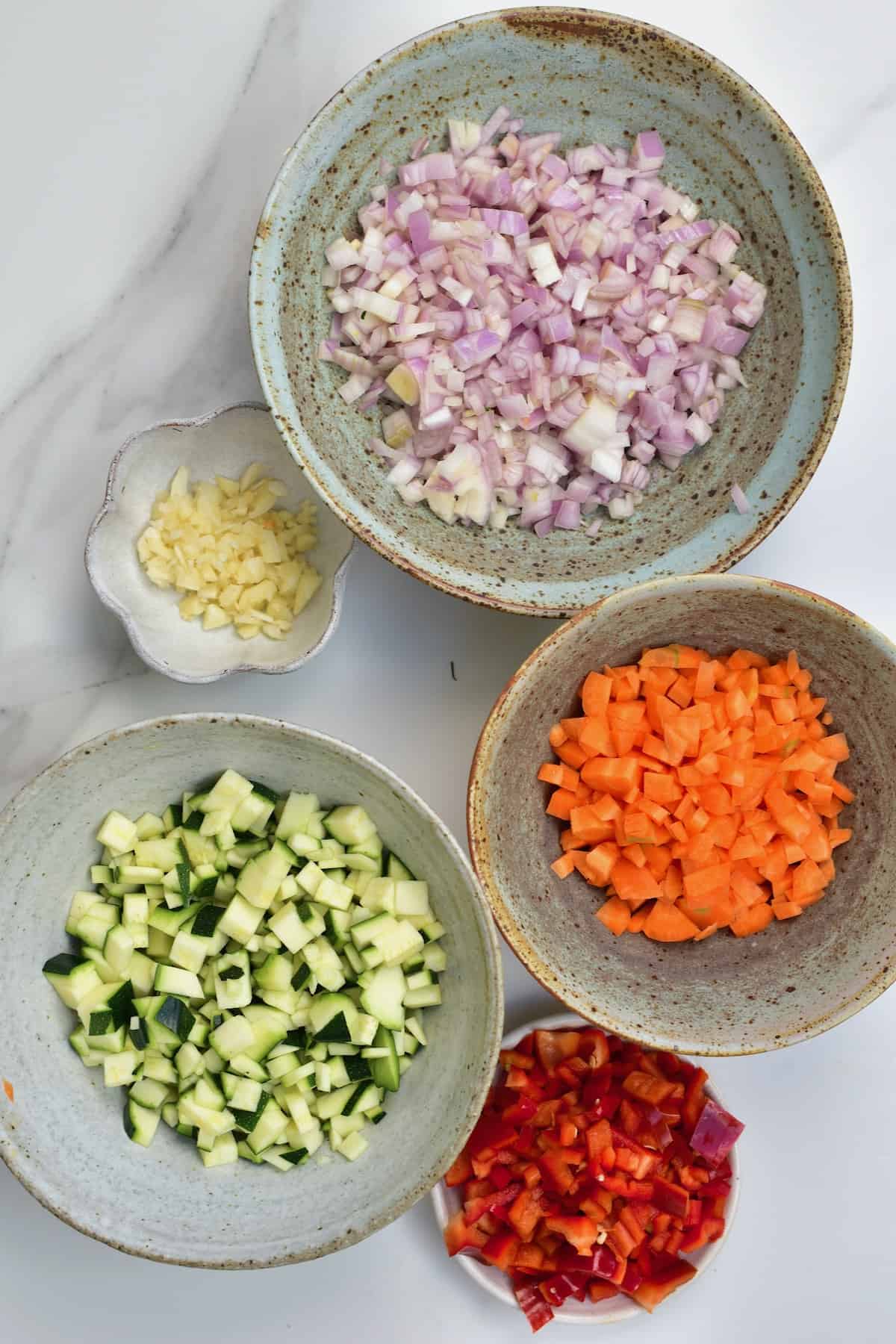 Chopped vegetables in separate bowls