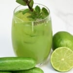 Cucumber lemonade in a glass topped with mint