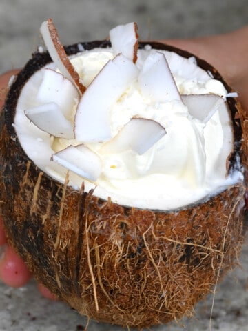 A coconut cup with coconut frappe and coconut flakes