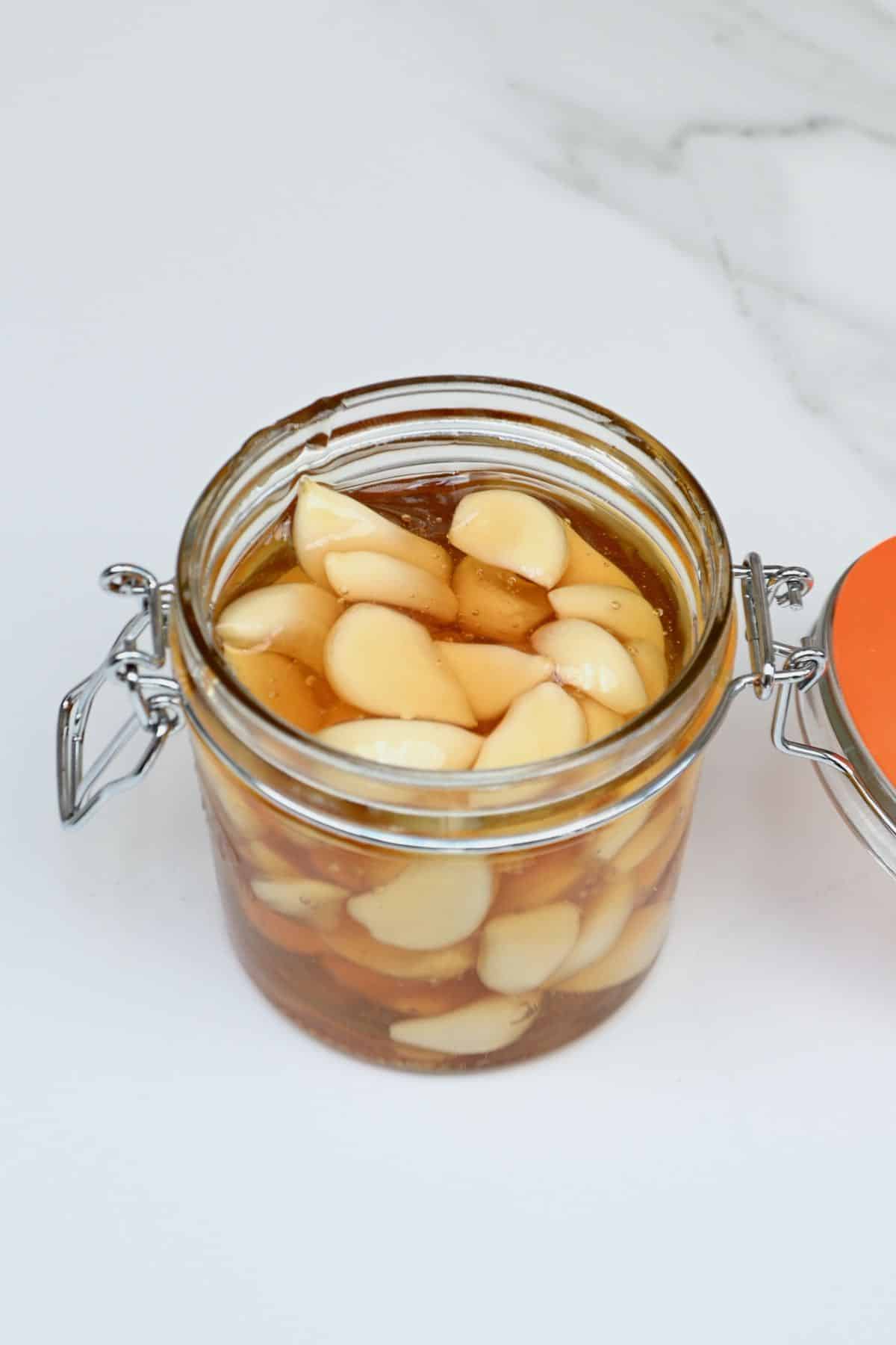 Top view of a jar with fermented honey garlic