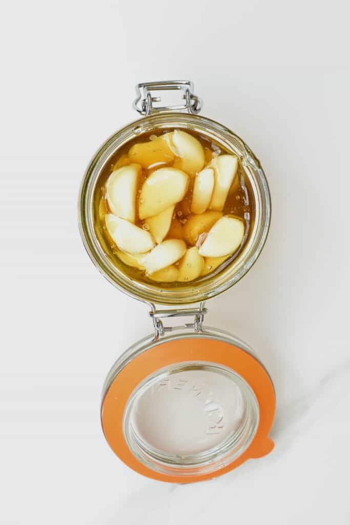 Top view of garlic and honey in a jar
