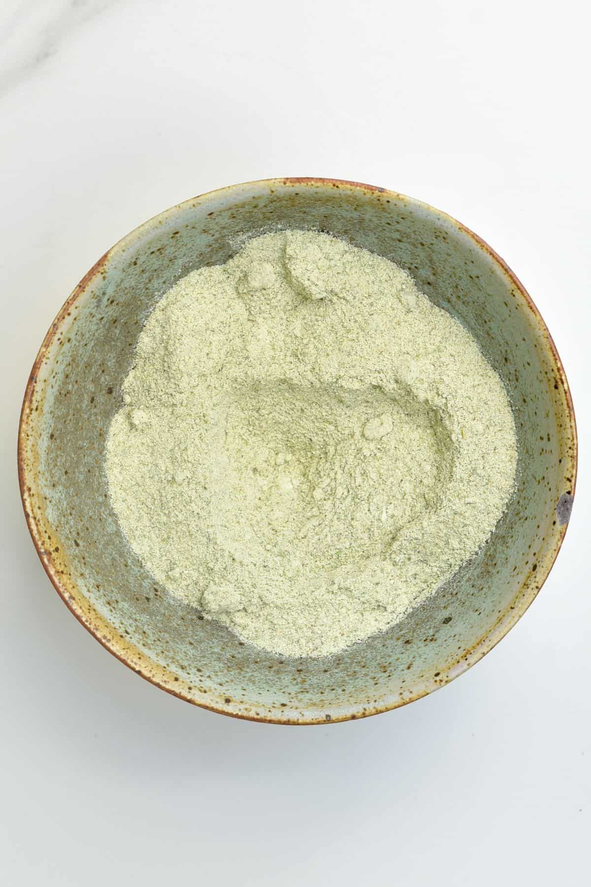 A bowl with finely ground herb salt