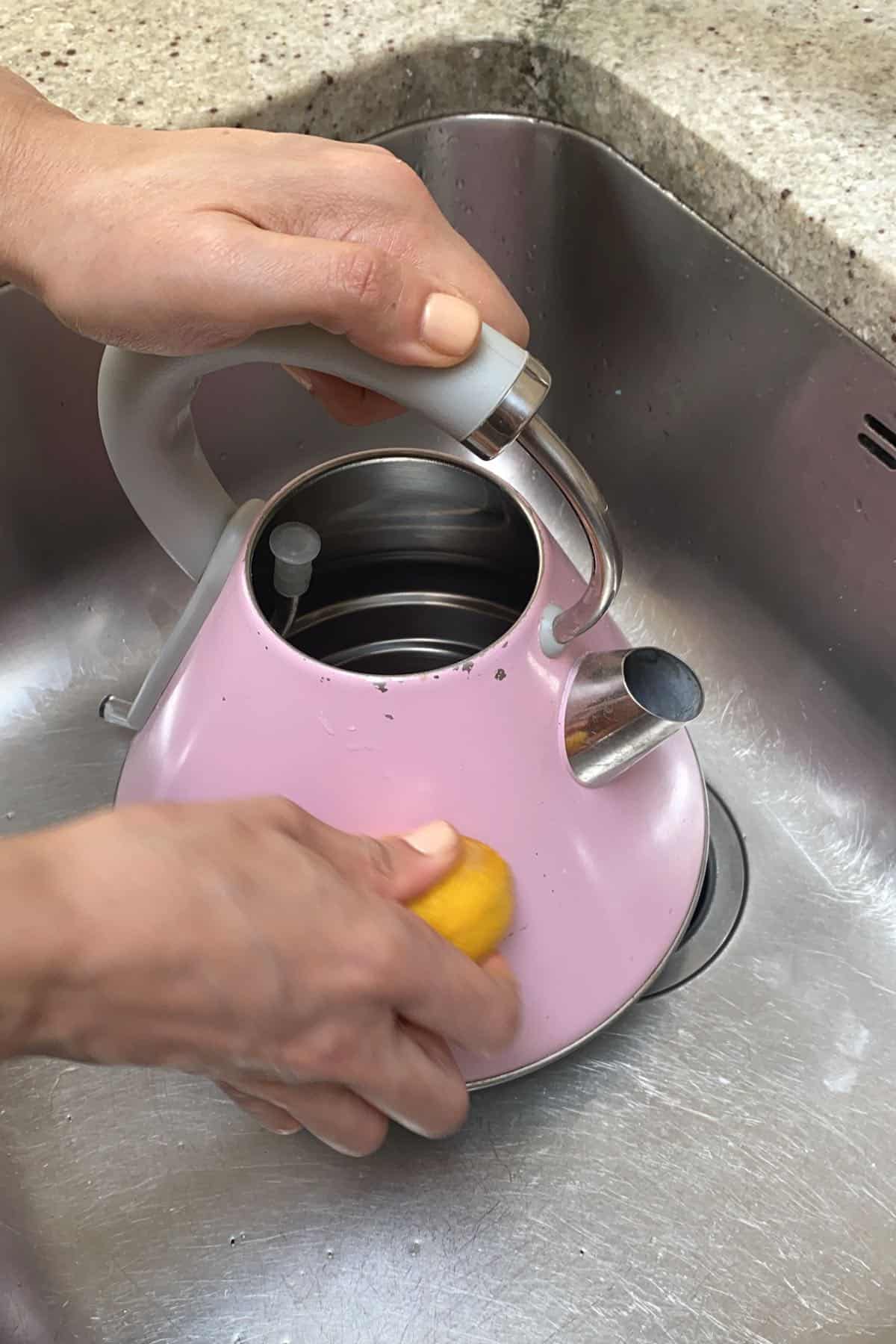 Cleaning the outside of kettle with lemon