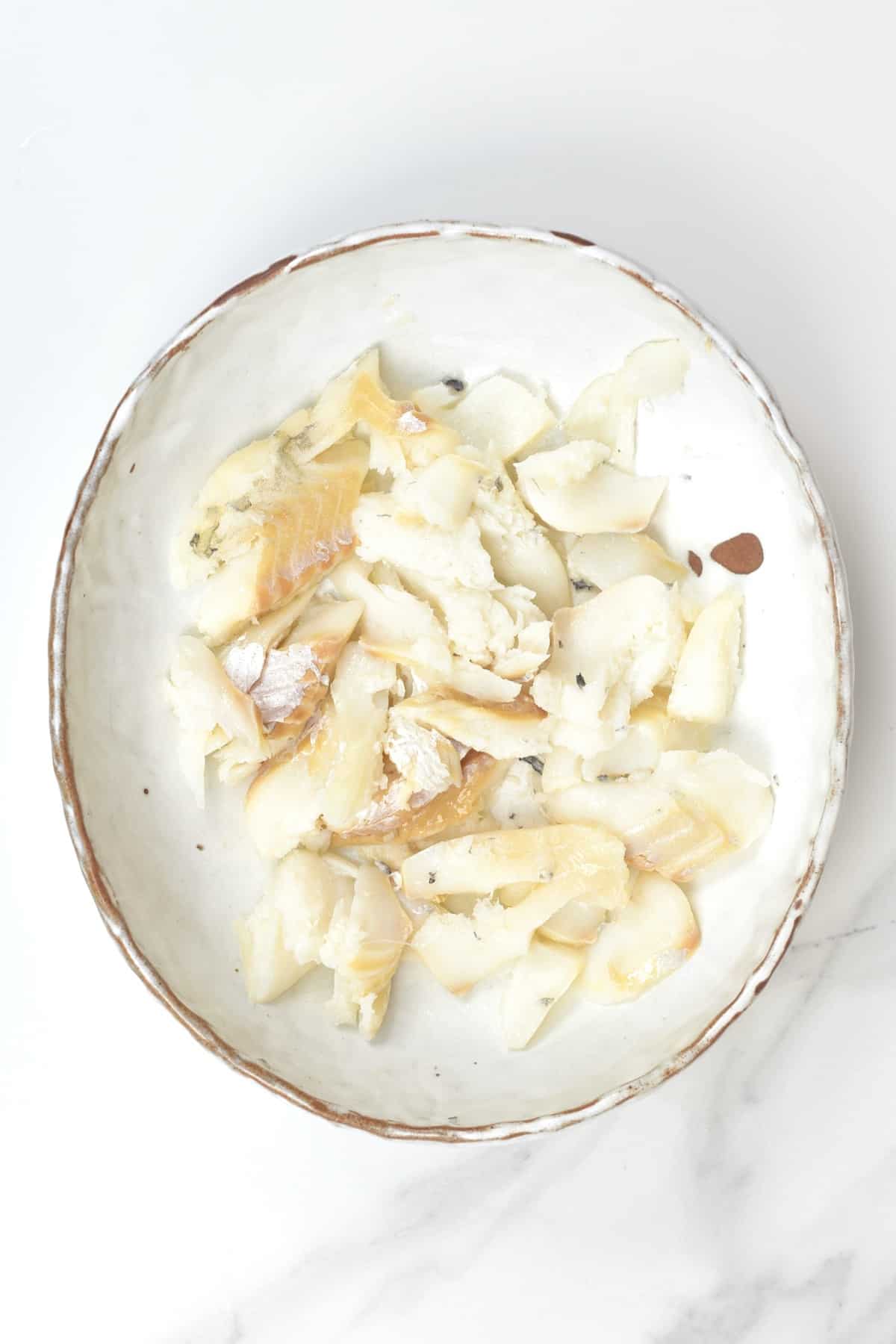 A bowl with cooked salted cod fish