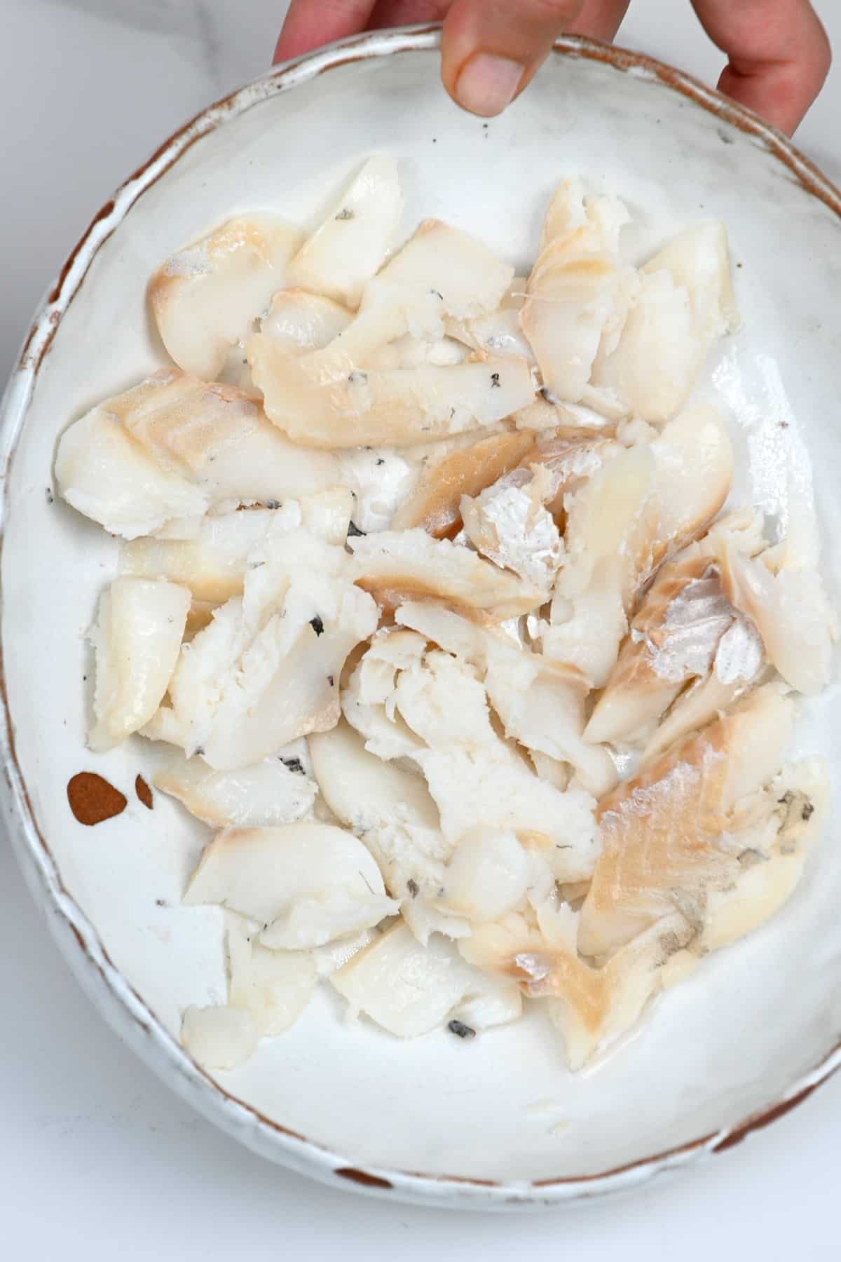 Cooked salted cod fish in a bowl