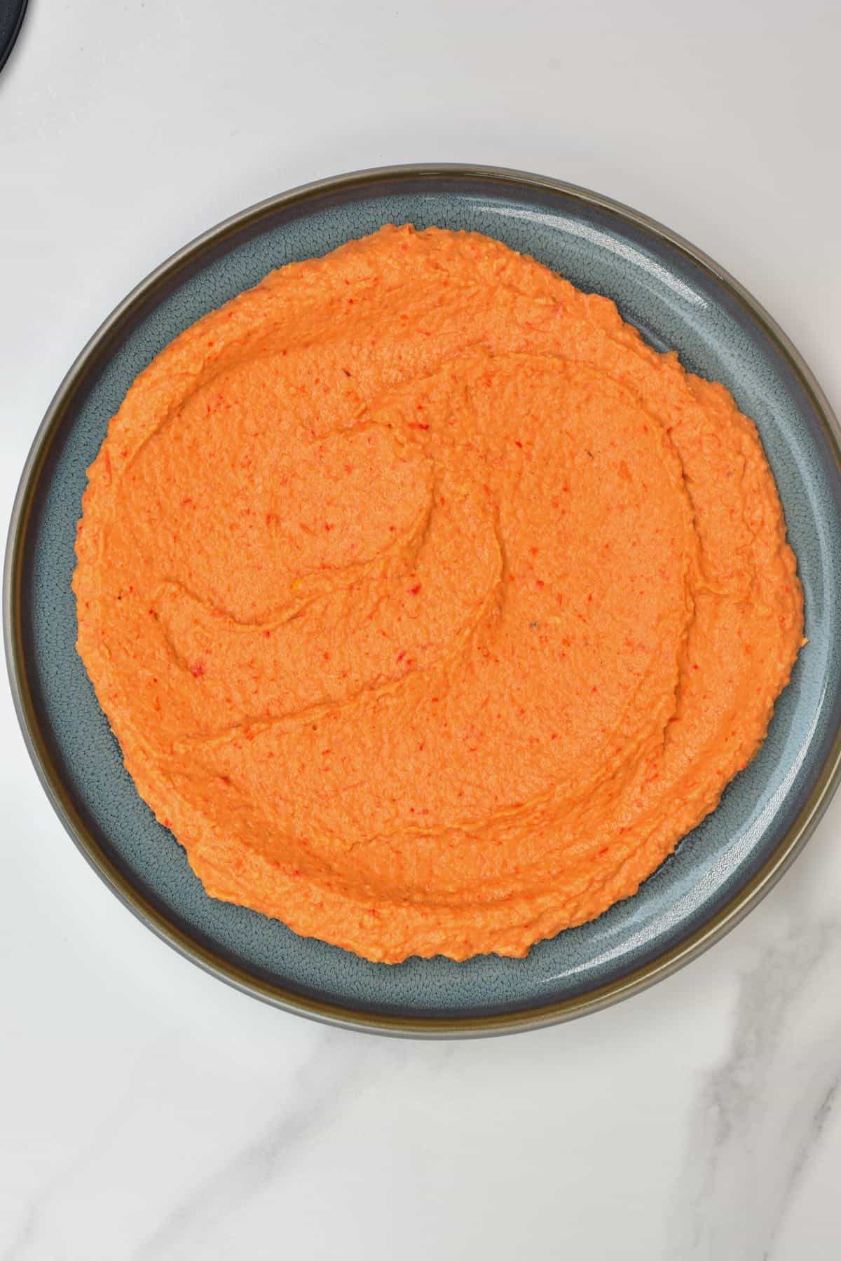 Roasted red pepper hummus in a plate