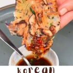 Korean vegetable pancake dipped in sauce