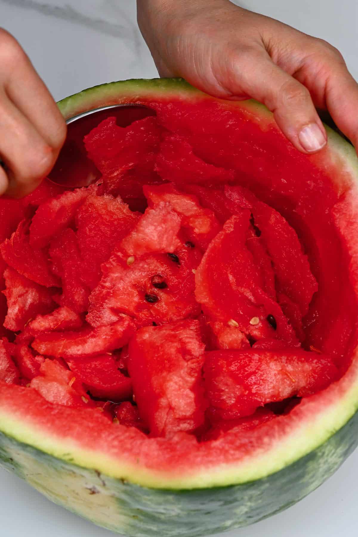 Removing the flesh of a watermelon