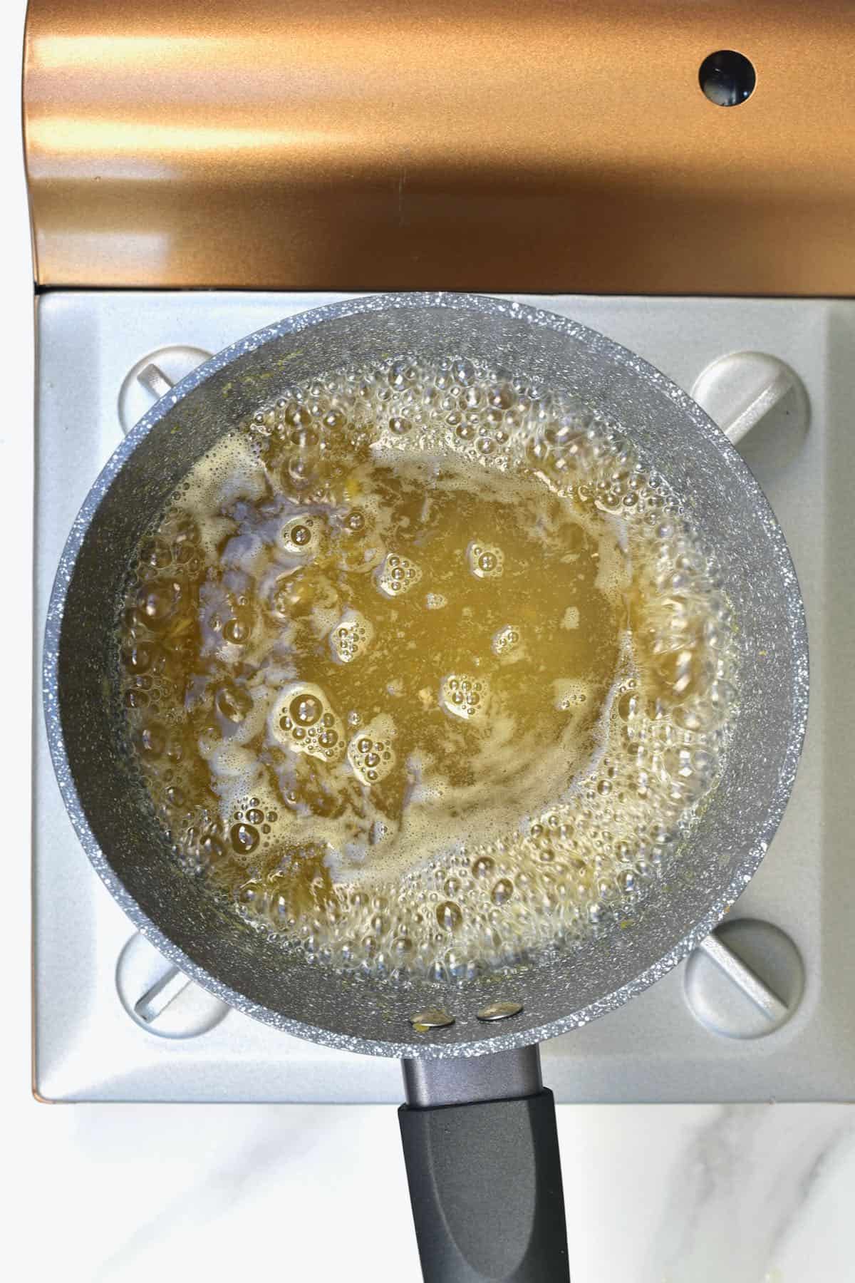 Making ginger syrup in a pot