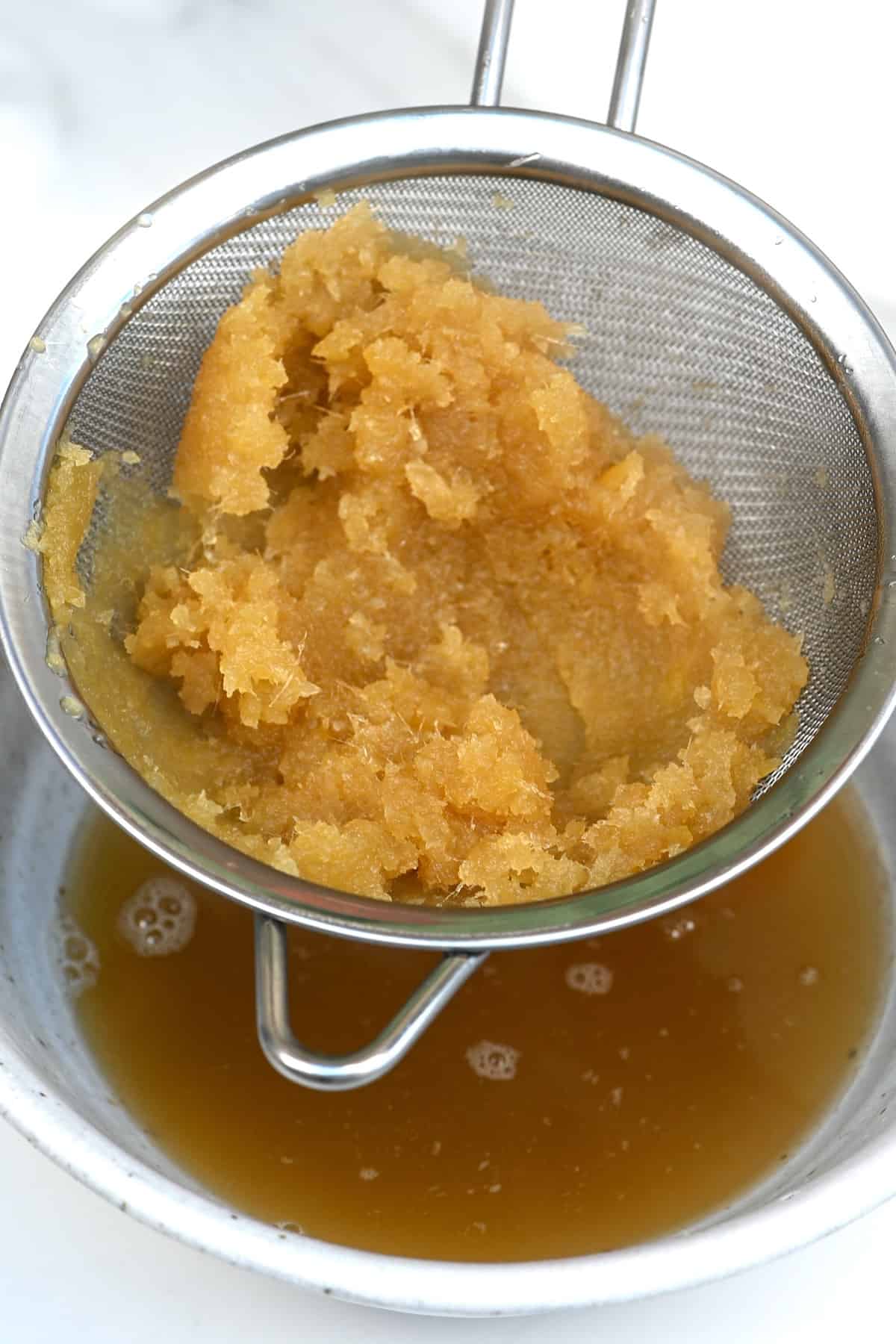Sieving ginger syrup