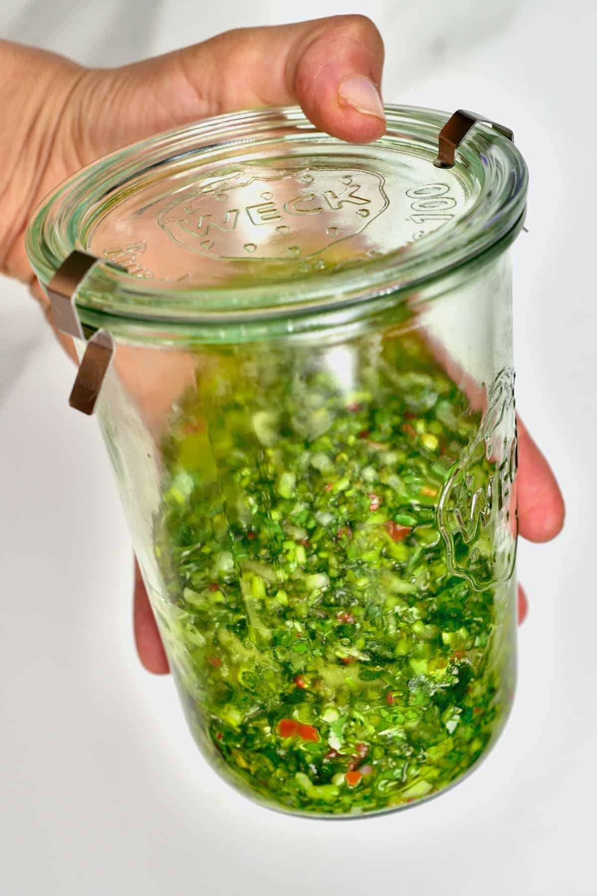 A jar with chimichurri
