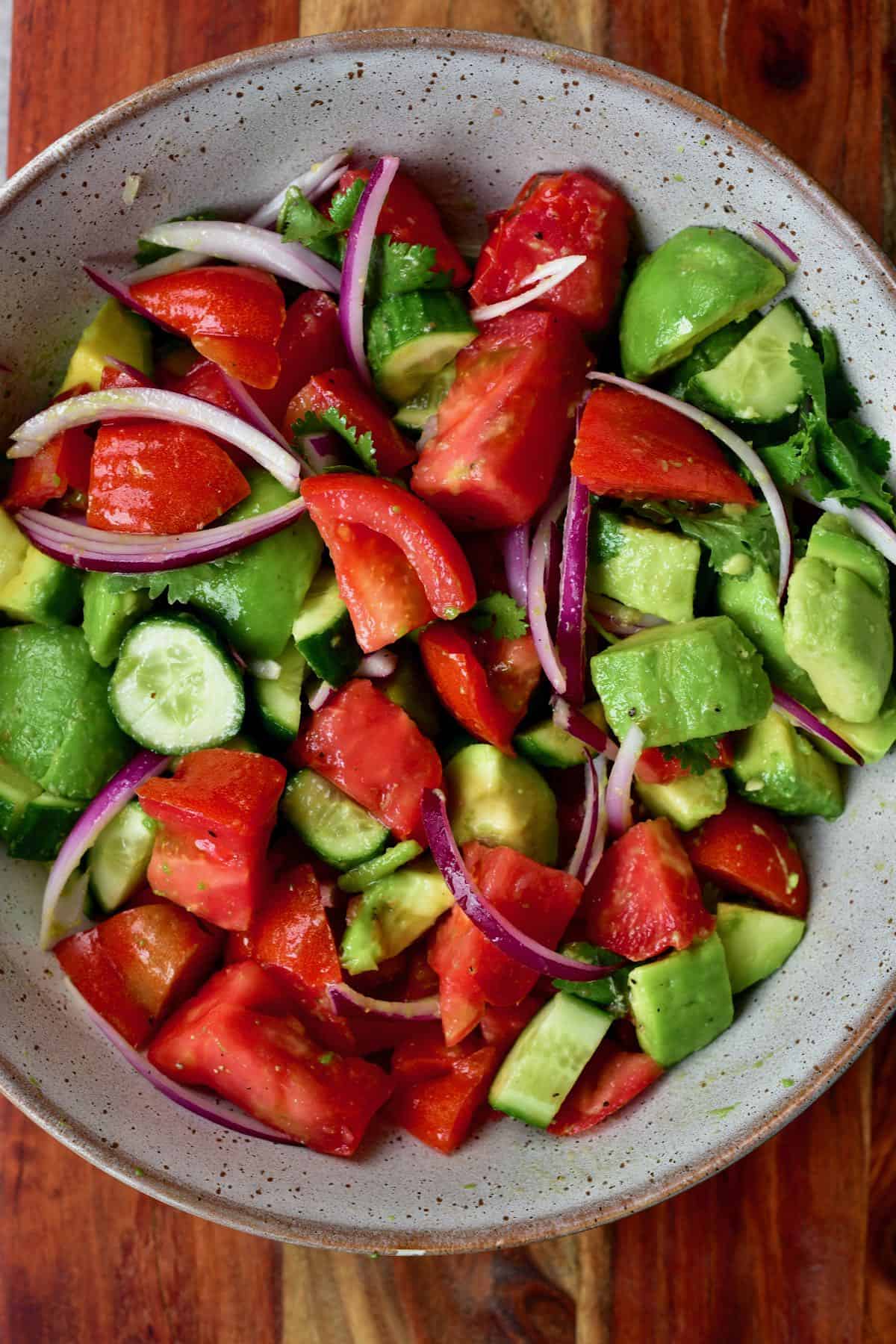 Avocado cucumber tomato salad in a bowl