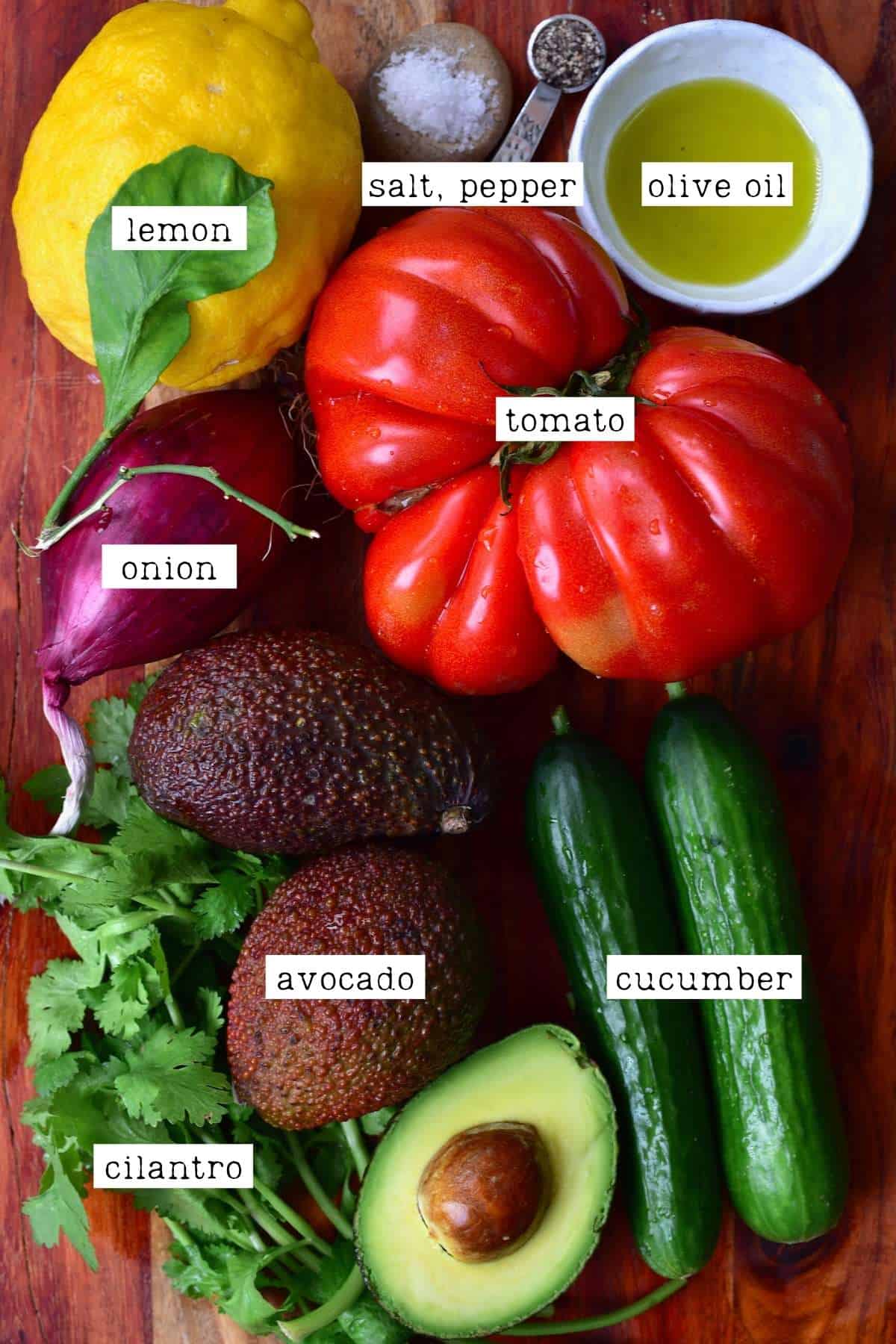 Ingredients for avocado cucumber tomato salad