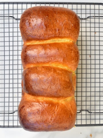 A French brioche on a cooling rack