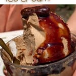 Half eaten serving of coffee ice cream topped with syrup