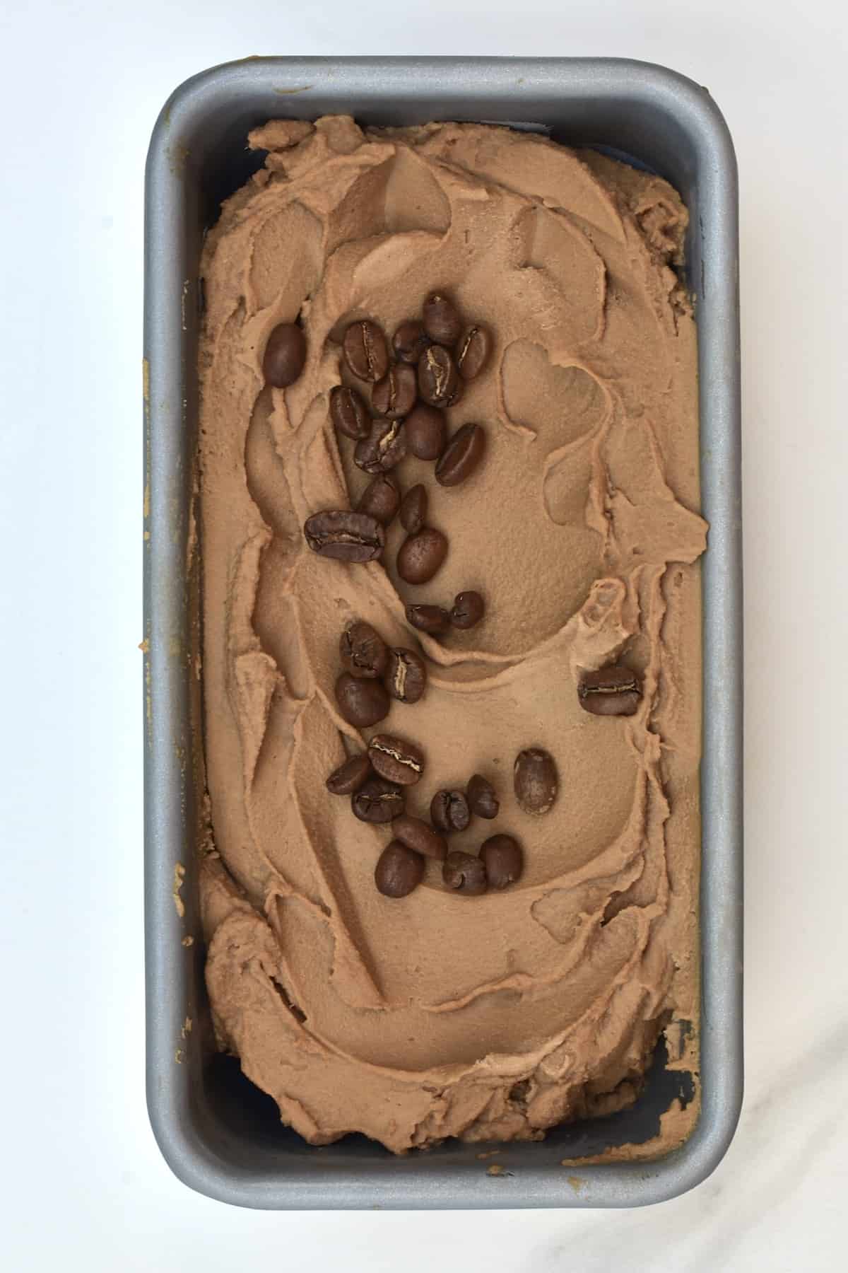 Coffee ice cream topped with coffee beans