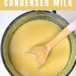 Condensed milk in a pot with a spoon