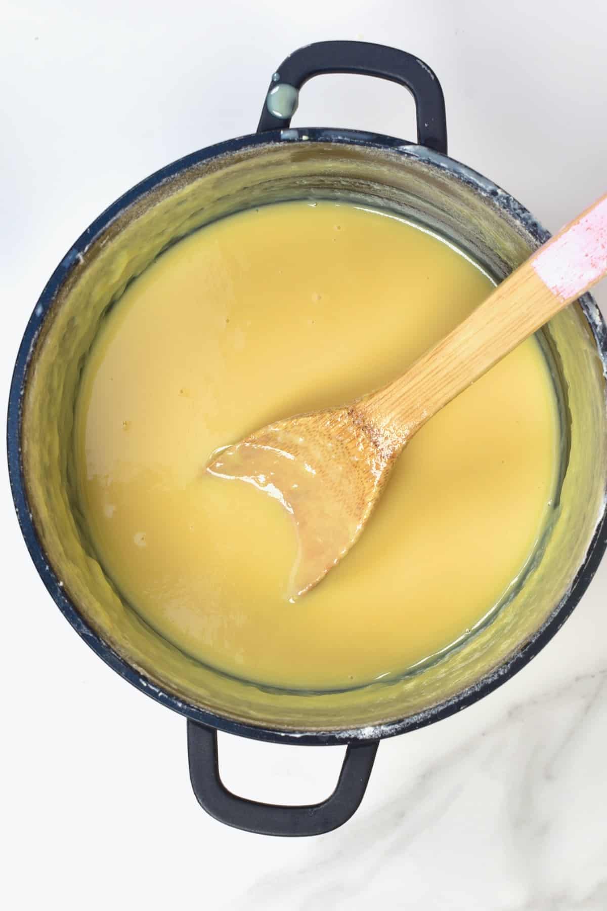 Homemade condensed milk in a pot