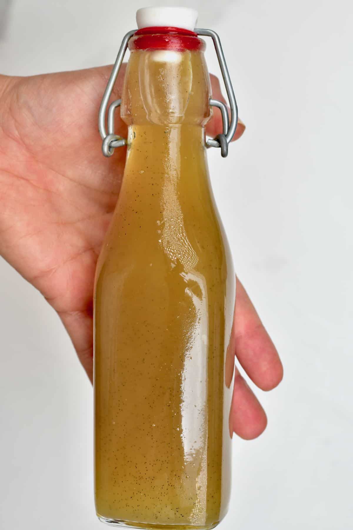 A bottle with ginger simple syrup