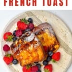 A plate with berries and french toast