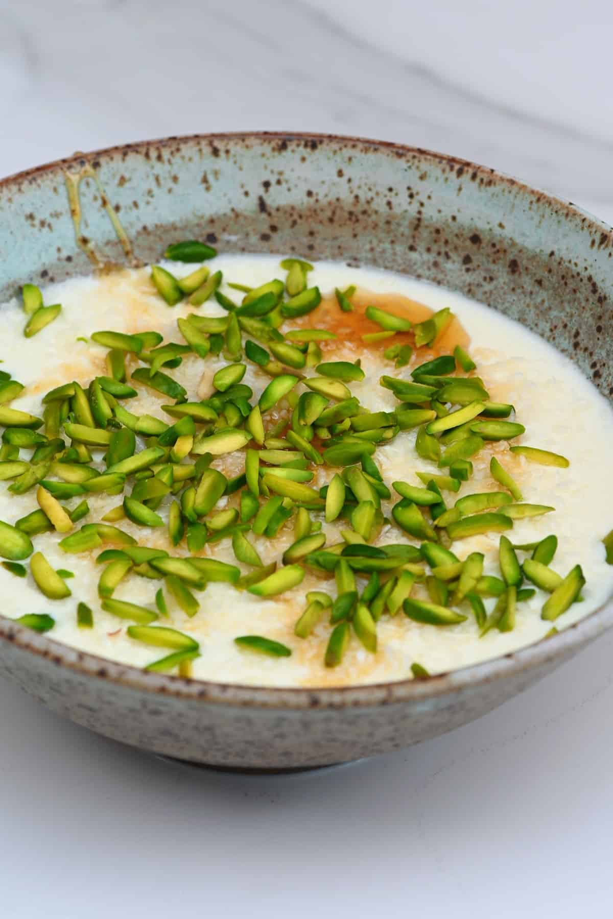 Ginger milk pudding topped with pistachios