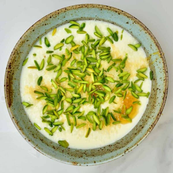 Ginger milk pudding topped with pistachios