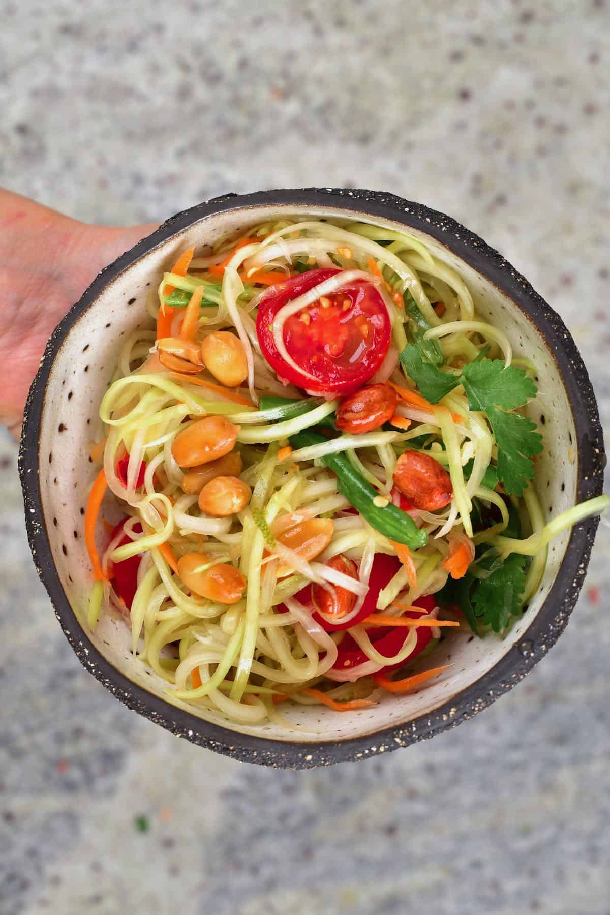 Green papaya salad in a bowl