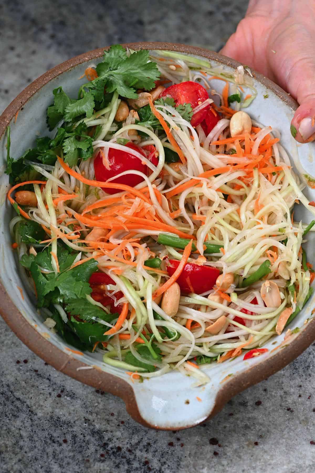 Green papaya salad in a bowl