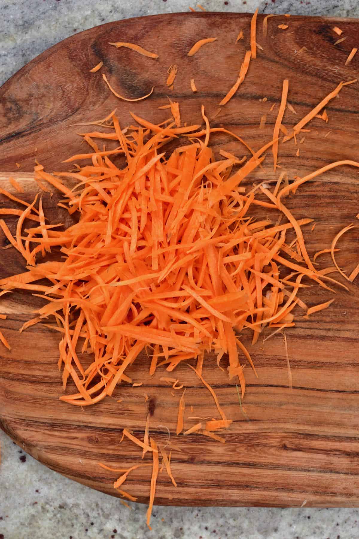 Shredded carrot on a cutting board