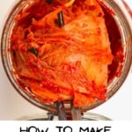 Scooping out homemade kimchi from a jar
