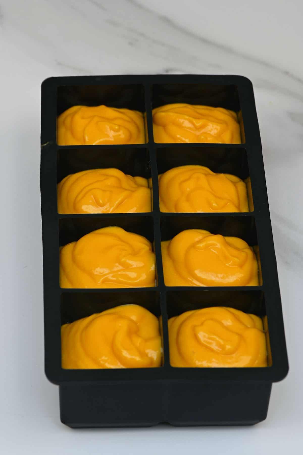 Mango puree places in ice cube tray