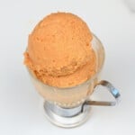 Two balls of peach ice cream in a small cup - 24