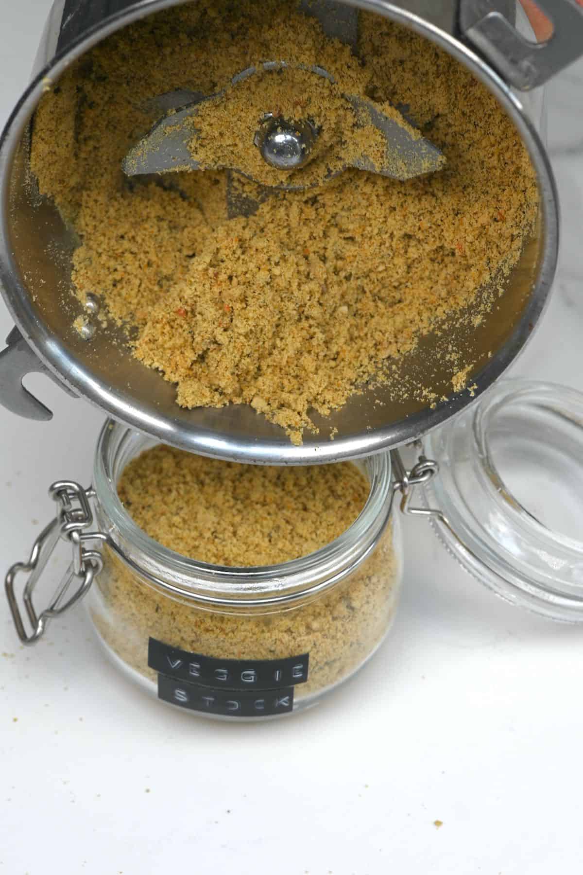Transferring powdered vegetable stock into a jar