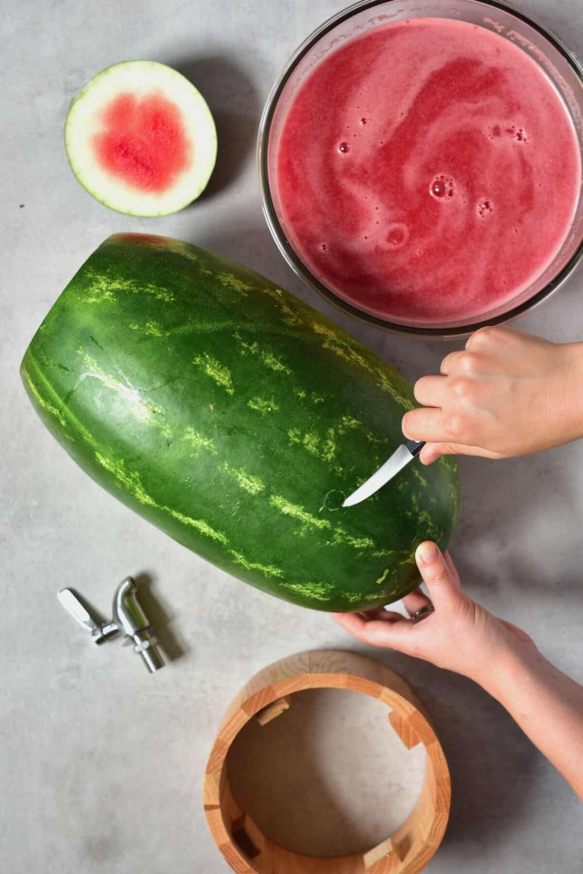 Making a watermelon keg dispenser