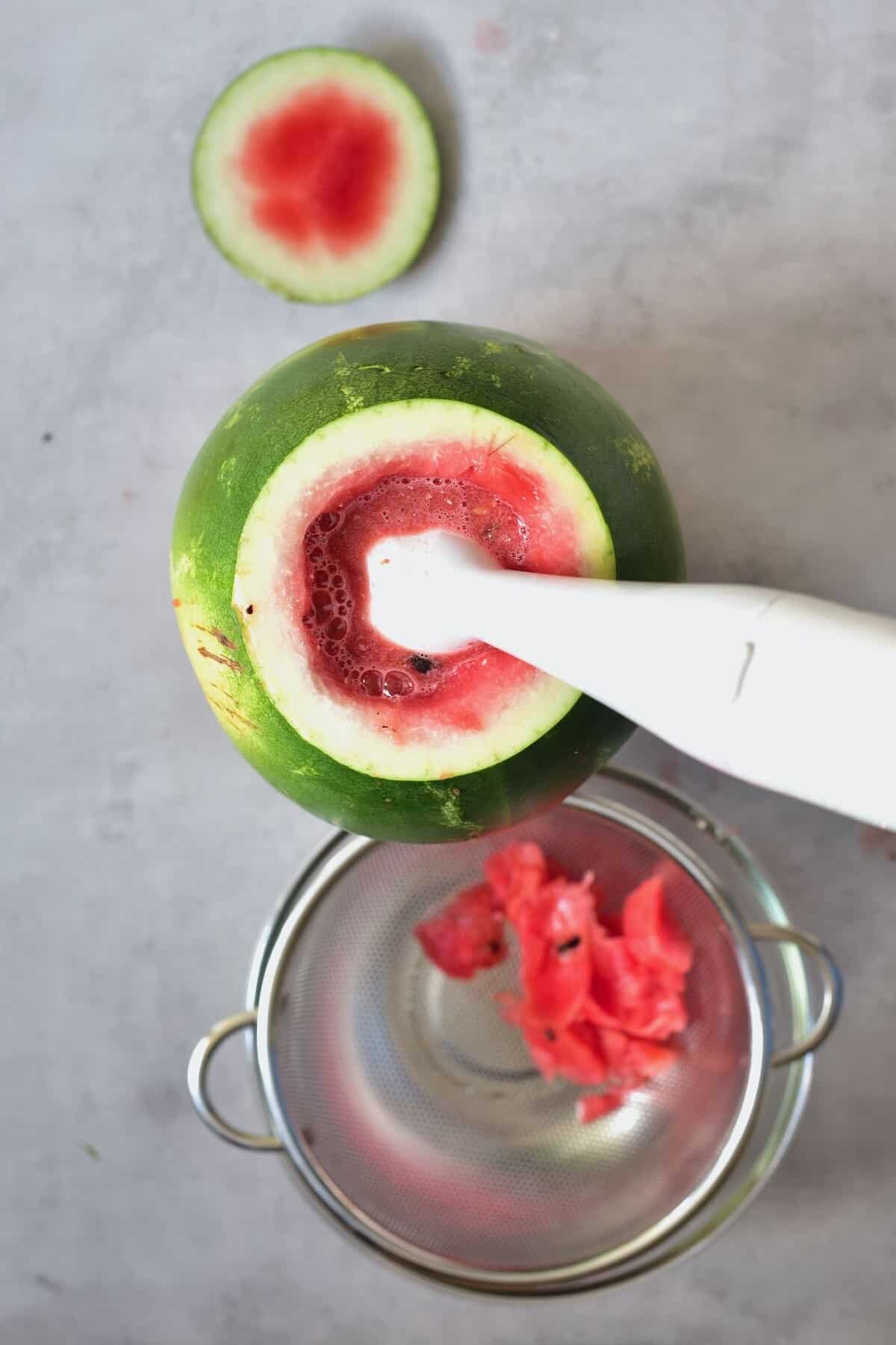 Making watermelon juice with a blender
