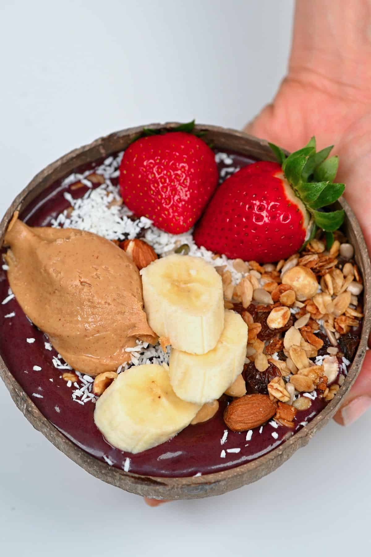 Acai bowl topped with banana and strawberries