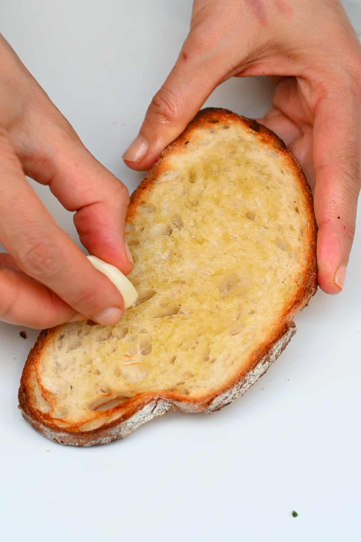 Rubbing garlic on toast