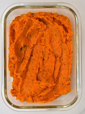Roasted carrot dip in a container