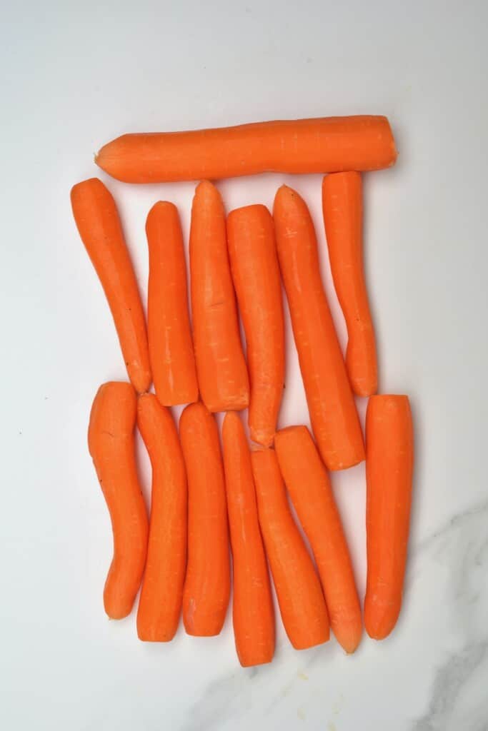 Peeled carrots on a flat surface