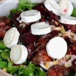 roasted beet and goat cheese salad in a bowl