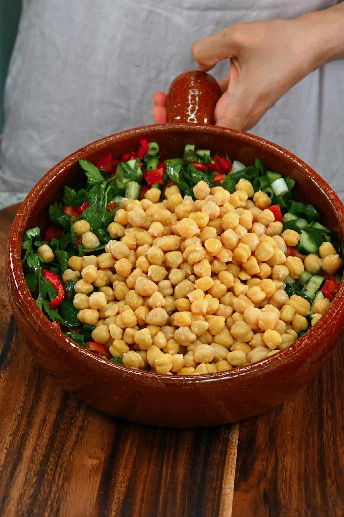 Chickpeas added to salad