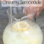 Stirring creamy lemonade in a pitcher