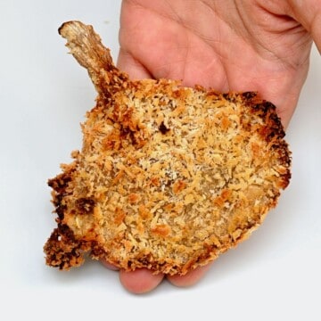 Hand holding crispy oyster mushroom
